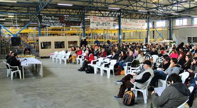 Workers of VIO.ME at a meeting. Photo by Liam Barrington-Bush. CC BY-NC-ND